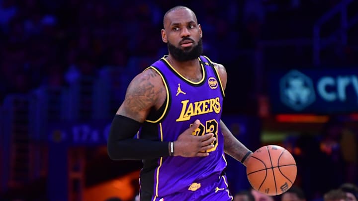 Feb 25, 2025; Los Angeles, California, USA; Los Angeles Lakers forward LeBron James (23) dribbles the ball against the Dallas Mavericks during the second half at Crypto.com Arena. Mandatory Credit: Gary A. Vasquez-Imagn Images