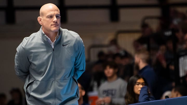 Penn State head wrestling coach Cael Sanderson looks on Big Ten match against Ohio State in 2024. Penn State head wrestling coach Cael Sanderson looks on Big Ten match against Ohio State in 2024.