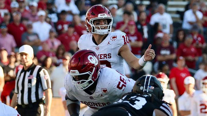 Oklahoma quarterback John Mateer sends a teammate in motion before a snap against Mississippi State.
