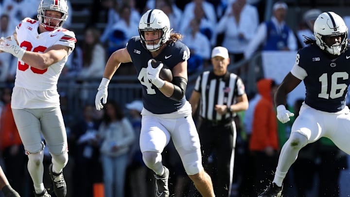 Nov 2, 2024; University Park, Pennsylvania, USA; Penn State Nittany Lions tight end Tyler Warren (44) runs with the ball during the first quarter against the Ohio State Buckeyes at Beaver Stadium.