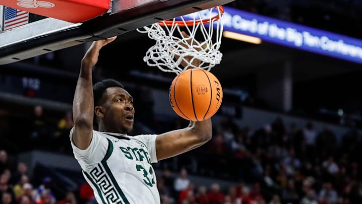 Michigan State forward Xavier Booker (34) dunks against Minnesota during the first half of Second Round of Big Ten tournament at Target Center in Minneapolis, Minn. on Thursday, March 14, 2024.