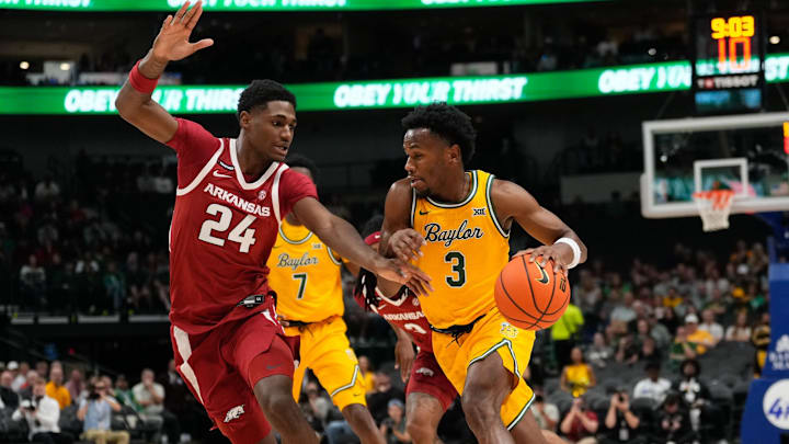 Nov 9, 2024; Dallas, Texas, USA;  Baylor Bears guard Jeremy Roach (3) drives to the basket against Arkansas Razorbacks forward Billy Richmond III (24) during the first half at American Airlines Center. Mandatory Credit: Chris Jones-Imagn Images