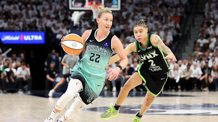 Oct 18, 2024; Minneapolis, Minnesota, USA; New York Liberty guard Courtney Vandersloot (22) drives past Minnesota Lynx guard Natisha Hiedeman (2) during the second half of game four of the 2024 WNBA Finals at Target Center. Mandatory Credit: Matt Krohn-Imagn Images