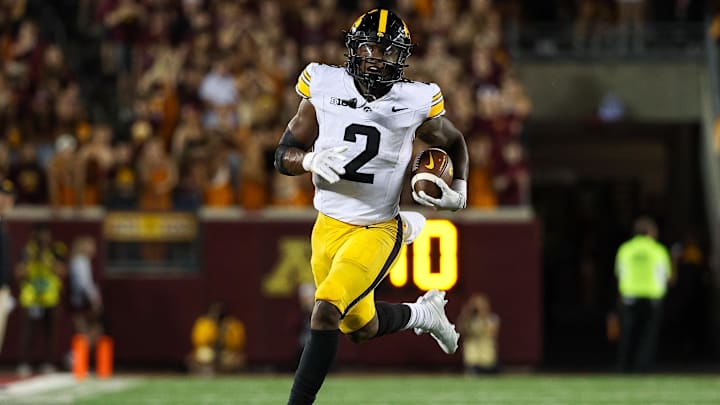 Sep 21, 2024; Minneapolis, Minnesota, USA; Iowa Hawkeyes running back Kaleb Johnson (2) runs the ball against the Minnesota Golden Gophers during the second half at Huntington Bank Stadium. Mandatory Credit: Matt Krohn-Imagn Images