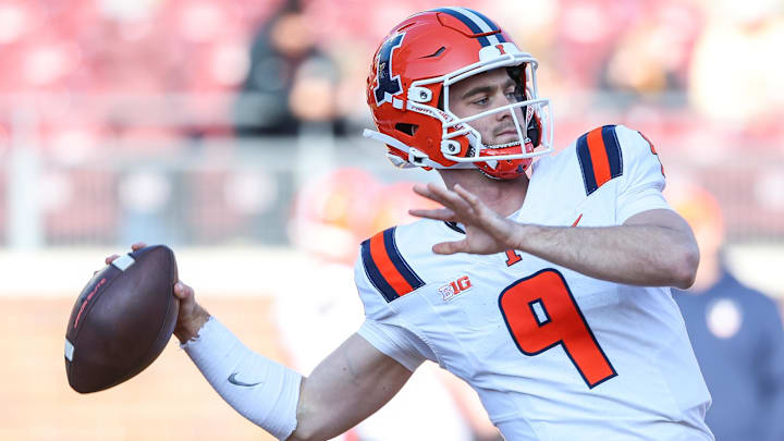 Nov 4, 2023; Minneapolis, Minnesota, USA; Illinois Fighting Illini quarterback Luke Altmyer (9) warms up before the game against the Minnesota Golden Gophers at Huntington Bank Stadium. Mandatory Credit: Matt Krohn-Imagn Images