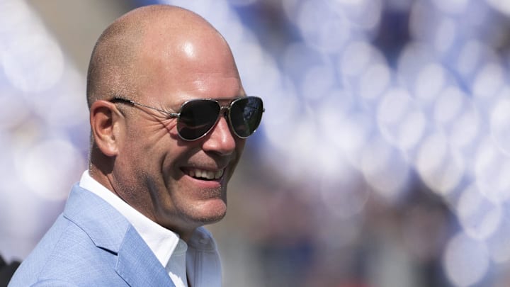 Sep 15, 2024; Baltimore, Maryland, USA;  Baltimore Ravens general manager Eric DeCosta walks across the the field before the game against the Las Vegas Raiders at M&T Bank Stadium. Mandatory Credit: Tommy Gilligan-Imagn Images