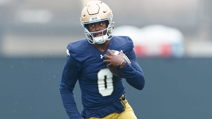 Notre Dame wide receiver Malachi Fields runs with the ball during a football practice at Irish Athletic Center on Thursday, July 31, 2025, in South Bend.