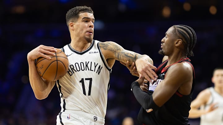 Dec 23, 2025; Philadelphia, Pennsylvania, USA; Brooklyn Nets forward Michael Porter Jr. (17) drives against Philadelphia 76ers guard Tyrese Maxey (0) during the first quarter at Xfinity Mobile Arena. Mandatory Credit: Bill Streicher-Imagn Images