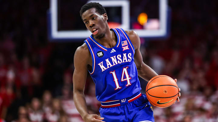 Feb 28, 2026; Tucson, Arizona, USA; Kansas Jayhawks guard Melvin Council Jr. (14) dribbles the ball during the first half of the game against the Arizona Wildcats at McKale Memorial Center. Mandatory Credit: Aryanna Frank-Imagn Images