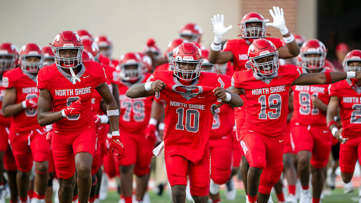 North Shore players take to the field before their 2024 season opener in Houston.