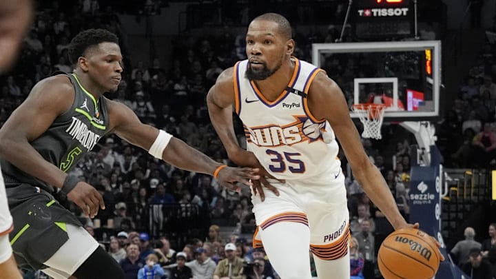 Mar 28, 2025; Minneapolis, Minnesota, USA; Phoenix Suns forward Kevin Durant (35) brings the ball up as Minnesota Timberwolves guard Anthony Edwards (5) defends him in the fourth quarter at Target Center. Mandatory Credit: Bruce Kluckhohn-Imagn Images Mar 28, 2025; Minneapolis, Minnesota, USA; Phoenix Suns forward Kevin Durant (35) brings the ball up as Minnesota Timberwolves guard Anthony Edwards (5) defends him in the fourth quarter at Target Center. Mandatory Credit: Bruce Kluckhohn-Imagn Images