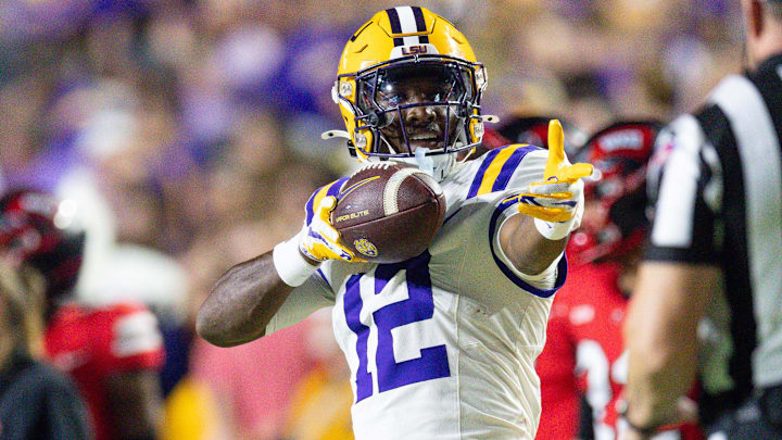 Nov 22, 2025; Baton Rouge, Louisiana, USA; LSU Tigers wide receiver Kyle Parker (12) reacts to making a first down against Western Kentucky Hilltoppers defensive back Nazir Ward (not pictured) during the first half at Tiger Stadium. Mandatory Credit: Stephen Lew-Imagn Images Nov 22, 2025; Baton Rouge, Louisiana, USA; LSU Tigers wide receiver Kyle Parker (12) reacts to making a first down against Western Kentucky Hilltoppers defensive back Nazir Ward (not pictured) during the first half at Tiger Stadium. Mandatory Credit: Stephen Lew-Imagn Images