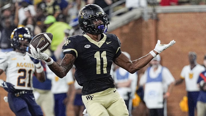 Wake Forest Demon Deacons wide receiver Donavon Greene (11) reacts to his touchdown against the North Carolina A&T Aggies during the first half at Allegacy Federal Credit Union Stadium. Wake Forest Demon Deacons wide receiver Donavon Greene (11) reacts to his touchdown against the North Carolina A&T Aggies during the first half at Allegacy Federal Credit Union Stadium.
