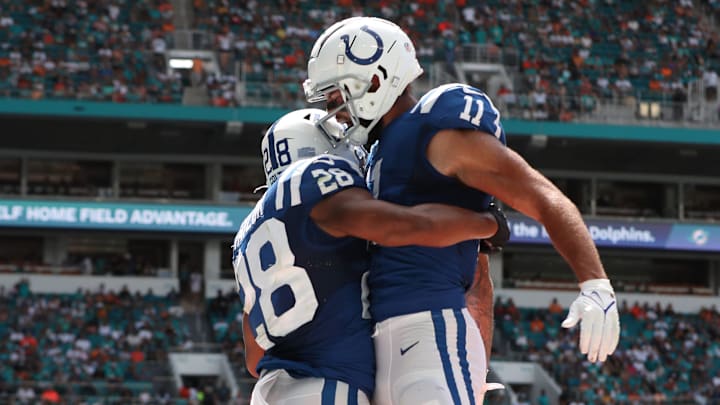 Jonathan Taylor (left), jumps with teammate Michael Pittman Jr. after Taylor's Colts touchdown at Hard Rock Stadium in Miami Gardens, Fla., on Sunday, Oct. 3, 2021, during first half Miami vs. Indianapolis action. Jonathan Taylor (left), jumps with teammate Michael Pittman Jr. after Taylor's Colts touchdown at Hard Rock Stadium in Miami Gardens, Fla., on Sunday, Oct. 3, 2021, during first half Miami vs. Indianapolis action.