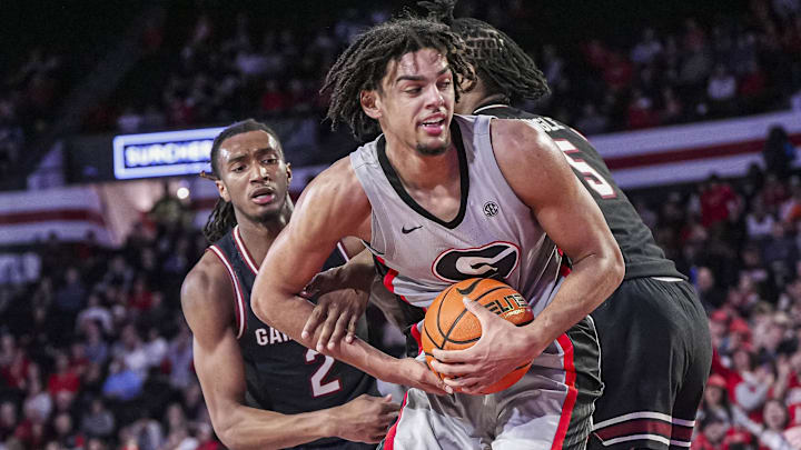 Jan 28, 2025; Athens, Georgia, USA; Georgia Bulldogs forward Asa Newell (14) grabs a rebound between South Carolina Gamecocks guard Zachary Davis (2) and forward Nick Pringle (5) during the second half at Stegeman Coliseum. Mandatory Credit: Dale Zanine-Imagn Images Jan 28, 2025; Athens, Georgia, USA; Georgia Bulldogs forward Asa Newell (14) grabs a rebound between South Carolina Gamecocks guard Zachary Davis (2) and forward Nick Pringle (5) during the second half at Stegeman Coliseum. Mandatory Credit: Dale Zanine-Imagn Images