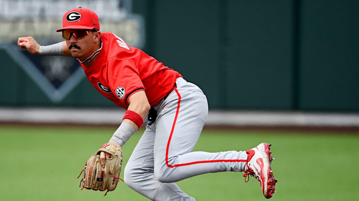 Georgia shortstop Kolby Branch (9) forces out Vanderbilt’s Colin Barczi (44) at second base for the third out as Branch watches his throw to first during the second inning of an NCAA college baseball game at Hawkins Field Saturday, April 19, 2025, in Nashville, Tenn. Georgia shortstop Kolby Branch (9) forces out Vanderbilt’s Colin Barczi (44) at second base for the third out as Branch watches his throw to first during the second inning of an NCAA college baseball game at Hawkins Field Saturday, April 19, 2025, in Nashville, Tenn.