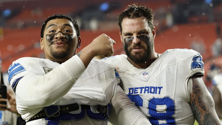 Nov 9, 2025; Landover, Maryland, USA; Detroit Lions offensive tackle Penei Sewell (L) celebrates with Lions offensive tackle Taylor Decker (68) while leaving the field after their game against the Washington Commanders at Northwest Stadium. Mandatory Credit: Geoff Burke-Imagn Images