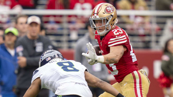November 17, 2024; Santa Clara, California, USA; San Francisco 49ers running back Christian McCaffrey (23) runs against Seattle Seahawks cornerback Coby Bryant (8) during the second quarter at Levi's Stadium. November 17, 2024; Santa Clara, California, USA; San Francisco 49ers running back Christian McCaffrey (23) runs against Seattle Seahawks cornerback Coby Bryant (8) during the second quarter at Levi's Stadium.