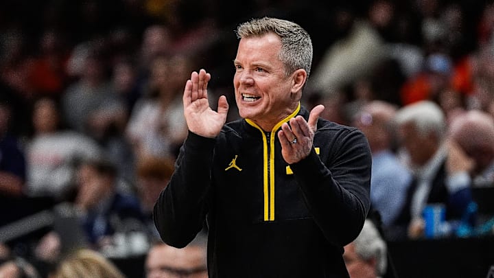 Michigan head coach Dusty May cheers on after a play against Auburn during the second half of the Sweet 16 round of the NCAA tournament at State Farm Arena on Friday, March 28, 2025.