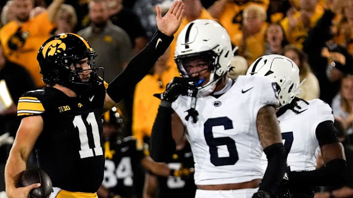 Iowa Hawkeyes quarterback Mark Gronowski (11) signals first down during a college football game against the Penn State Nittany Lions Oct. 18, 2025 at Kinnick Stadium in Iowa City, Iowa.