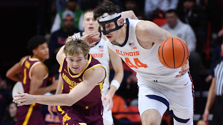 Jan 17, 2026; Champaign, Illinois, USA;  Illinois Fighting Illini forward Zvonimir Ivisic (44) steals the ball from Minnesota Golden Gophers guard Grayson Grove (2)  during the first half at State Farm Center. Mandatory Credit: Ron Johnson-Imagn Images