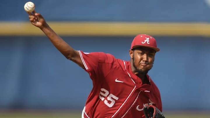 Alabama pitcher Dylan Smith (25) makes a pitch against Florida during the SEC Tournament Thursday, May 27, 2021, in the Hoover Met in Hoover, Alabama Alabama pitcher Dylan Smith (25) makes a pitch against Florida during the SEC Tournament Thursday, May 27, 2021, in the Hoover Met in Hoover, Alabama