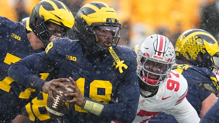 Ohio State Buckeyes defensive end Kenyatta Jackson Jr. (97) sacks Michigan Wolverines quarterback Bryce Underwood (19) during the NCAA football game at Michigan Stadium in Ann Arbor, Mich. on Nov. 29, 2025. Ohio State won 27-9.