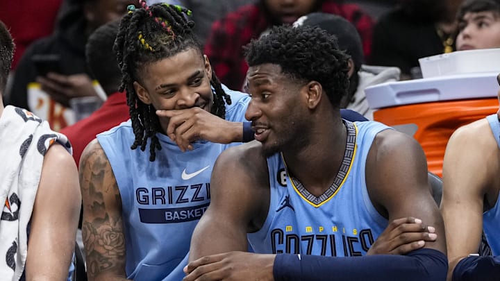 Mar 26, 2023; Atlanta, Georgia, USA; Memphis Grizzlies guard Ja Morant (12) and forward Jaren Jackson Jr. (13) react ons the bench during the game against the Atlanta Hawks during the second half at State Farm Arena. Mandatory Credit: Dale Zanine-Imagn Images Mar 26, 2023; Atlanta, Georgia, USA; Memphis Grizzlies guard Ja Morant (12) and forward Jaren Jackson Jr. (13) react ons the bench during the game against the Atlanta Hawks during the second half at State Farm Arena. Mandatory Credit: Dale Zanine-Imagn Images