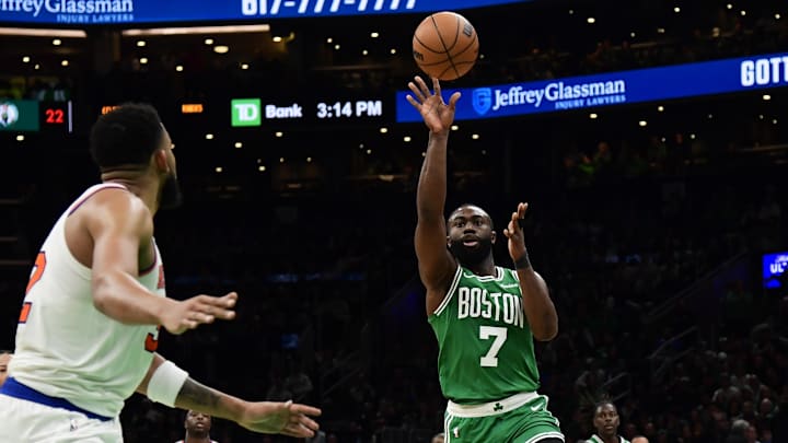 Feb 23, 2025; Boston, Massachusetts, USA;  Boston Celtics guard Jaylen Brown (7) passes the ball on an alley oop attempt to forward Jayson Tatum (0) during the second half against the New York Knicks at TD Garden. Mandatory Credit: Bob DeChiara-Imagn Images