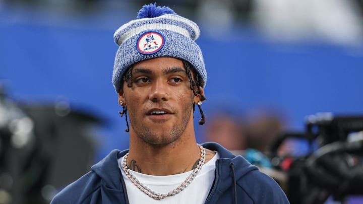 Aug 21, 2025; East Rutherford, New Jersey, USA; New England Patriots cornerback Christian Gonzalez (0) on the field before the preseason game against the New York Giants at MetLife Stadium. Mandatory Credit: Vincent Carchietta-Imagn Images