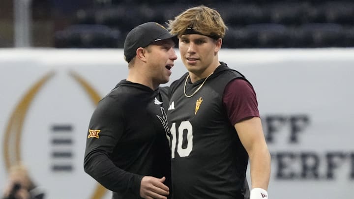 Arizona State quarterback Sam Leavitt (10) is greeted by head coach Kenny Dillingham before playing against Texas in the Chick-fil-A Peach Bowl on Jan 1, 2025, in Atlanta, Ga.