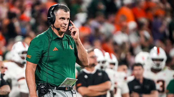 Miami Hurricanes Head Coach Mario Cristobal communicates with players in the game with Clemson during the second quarter at Memorial Stadium Saturday, October 3, 2026.