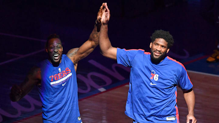 Apr 3, 2021; Philadelphia, Pennsylvania, USA; Philadelphia 76ers center Joel Embiid (21) high fives center Dwight Howard (39) during introductions against the Minnesota Timberwolves at Wells Fargo Center. Mandatory Credit: Eric Hartline-Imagn Images