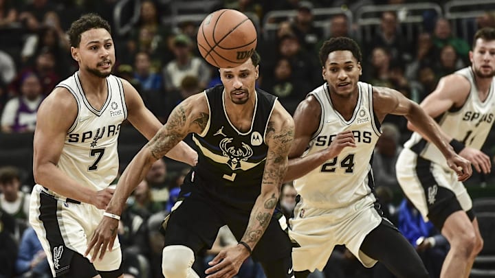 Oct 30, 2021; Milwaukee, Wisconsin, USA; Milwaukee Bucks guard George Hill (3) and San Antonio Spurs guard Bryn Forbes (7) and guard Devin Vassell (24) chase a loose ball in the second quarter at Fiserv Forum. Mandatory Credit: Benny Sieu-Imagn Images Oct 30, 2021; Milwaukee, Wisconsin, USA; Milwaukee Bucks guard George Hill (3) and San Antonio Spurs guard Bryn Forbes (7) and guard Devin Vassell (24) chase a loose ball in the second quarter at Fiserv Forum. Mandatory Credit: Benny Sieu-Imagn Images