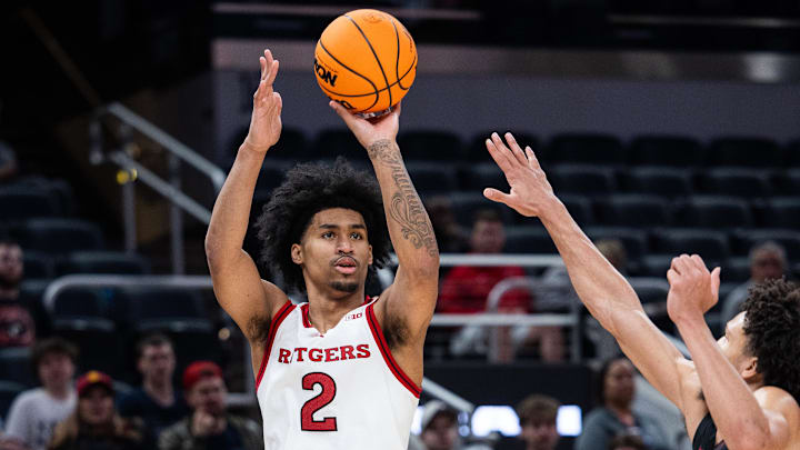 Mar 12, 2025; Indianapolis, IN, USA; Rutgers Scarlet Knights guard Dylan Harper (2) shoots the ball while USC Trojans guard Desmond Claude (1) defends in the second half at Gainbridge Fieldhouse. Mandatory Credit: Trevor Ruszkowski-Imagn Images
