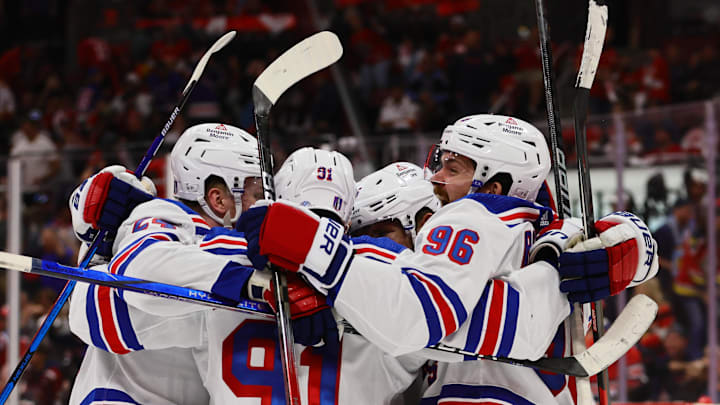May 26, 2024; Sunrise, Florida, USA; New York Rangers center Alex Wennberg (91) celebrates with center Jack Roslovic (96) and right wing Kaapo Kakko (24) after scoring the game-winning goal in overtime against the Florida Panthers in game three of the Eastern Conference Final of the 2024 Stanley Cup Playoffs at Amerant Bank Arena. Mandatory Credit: Sam Navarro-Imagn Images