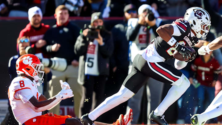 Nov 29, 2025; Columbia, South Carolina, USA; South Carolina Gamecocks defensive back Jalon Kilgore (24) celebrates after intercepting a pass intended for Clemson Tigers running back Adam Randall (8) in the first quarter at Williams-Brice Stadium. Mandatory Credit: Jeff Blake-Imagn Images