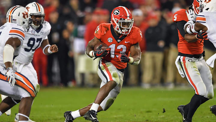 Nov 10, 2018; Athens, GA, USA; Georgia Bulldogs running back Elijah Holyfield (13) runs against the Auburn Tigers during the second half at Sanford Stadium. Mandatory Credit: Dale Zanine-Imagn Images Nov 10, 2018; Athens, GA, USA; Georgia Bulldogs running back Elijah Holyfield (13) runs against the Auburn Tigers during the second half at Sanford Stadium. Mandatory Credit: Dale Zanine-Imagn Images