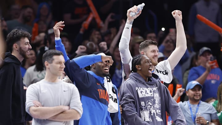 Feb 1, 2025; Oklahoma City, Oklahoma, USA; The Oklahoma City Thunder bench celebrates a basket by Oklahoma City Thunder guard Aaron Wiggins during the second half against the Sacramento Kings at Paycom Center. Mandatory Credit: Alonzo Adams-Imagn Images