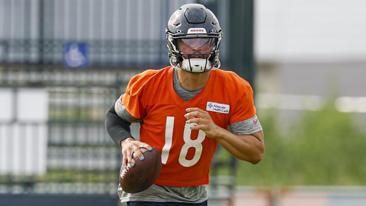Chicago Bears quarterback Caleb Williams (18) runs with the ball during training camp at Halas Hall.