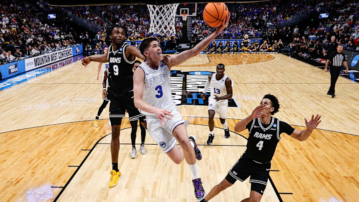 Mar 20, 2025; Denver, CO, USA; Brigham Young Cougars guard Egor Demin (3) drives to the net against VCU Rams forward Luke Bamgboye (9) as forward Jack Clark (4) defends in the second half at Ball Arena. Mandatory Credit: Isaiah J. Downing-Imagn Images