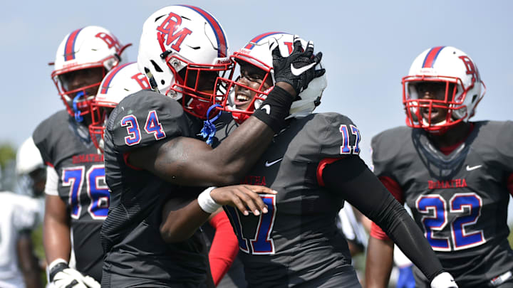 DeMatha Stags quarterback celebrates after a touchdown. 