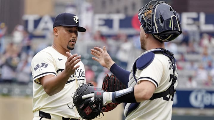 Apr 13, 2025; Minneapolis, Minnesota, USA; Minnesota Twins relief pitcher Jhoan Duran (59) and catcher Ryan Jeffers (27) celebrate the win over the Detroit Tigers at Target Field. Mandatory Credit: Bruce Kluckhohn-Imagn Images
