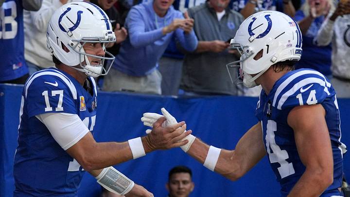Oct 12, 2025; Indianapolis, Indiana, USA; Indianapolis Colts quarterback Daniel Jones (17) celebrates with wide receiver Alec Pierce (14) after Jones scores a touchdown during a game against the Arizona Cardinals at Lucas Oil Stadium. Mandatory Credit: Christine Tannous-USA TODAY Network via Imagn Images