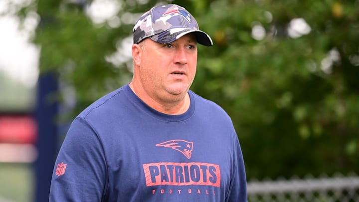 Jul 24, 2024; Foxborough, MA, USA;  New England Patriots offensive coordinator Alex Van Pelt walks to the practice fields during training camp at Gillette Stadium. Mandatory Credit: Eric Canha-Imagn Images