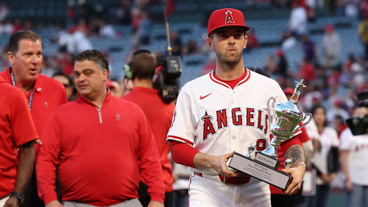Sep 28, 2024; Anaheim, California, USA;  Los Angeles Angels shortstop Zach Neto (9) holds a team MVP trophy prior to a game against the Texas Rangers at Angel Stadium. Mandatory Credit: Kiyoshi Mio-Imagn Images