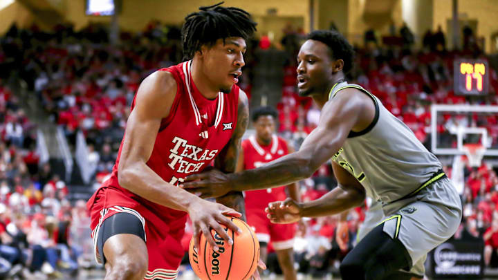 Feb 4, 2025; Lubbock, Texas, USA;  Texas Tech Red Raiders forward JT Toppin (15) dribbles the ball against Baylor Bears guard Jayden Nunn (2) in the first half at United Supermarkets Arena. Mandatory Credit: Michael C. Johnson-Imagn Images