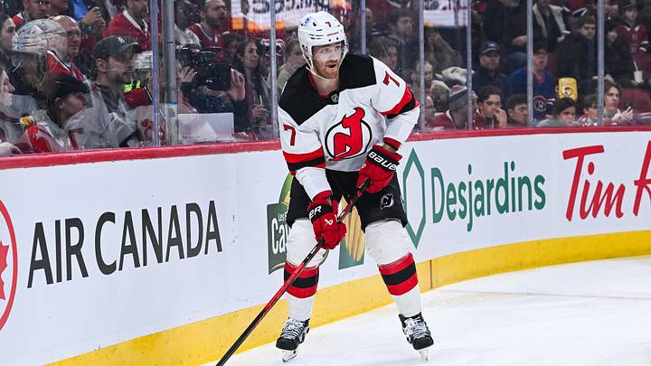 Apr 5, 2026; Montreal, Quebec, CAN; New Jersey Devils defenseman Dougie Hamilton (7) plays the puck against the Montreal Canadiens during the first period at Bell Centre. Mandatory Credit: David Kirouac-Imagn Images