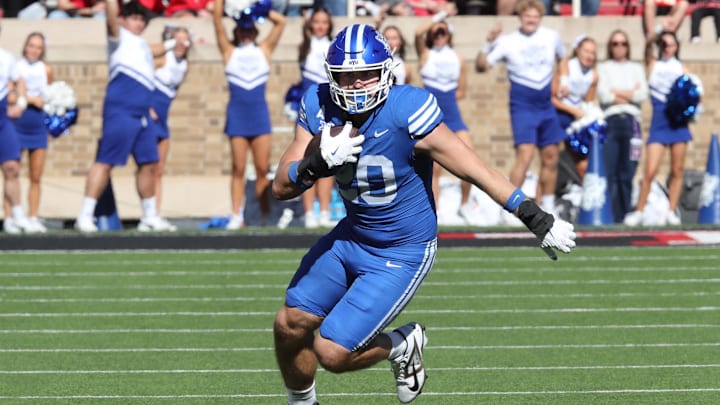 Nov 8, 2025; Lubbock, Texas, USA;  Brigham Young Cougars tight end  Carsen Ryan (20) rushes against the Texas Tech Red Raiders in the first half at Jones AT&T Stadium. Mandatory Credit: Michael C. Johnson-Imagn Images