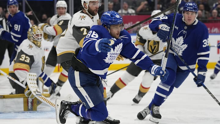 Nov 20, 2024; Toronto, Ontario, CAN; Toronto Maple Leafs forward William Nylander (88) is tripped by Vegas Golden Knights defenseman Alex Pietrangelo (7) during the third period at Scotiabank Arena. Mandatory Credit: John E. Sokolowski-Imagn Images Nov 20, 2024; Toronto, Ontario, CAN; Toronto Maple Leafs forward William Nylander (88) is tripped by Vegas Golden Knights defenseman Alex Pietrangelo (7) during the third period at Scotiabank Arena. Mandatory Credit: John E. Sokolowski-Imagn Images